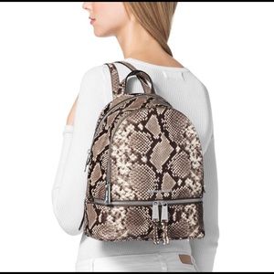 Michael Kors Snakeskin Pattern Rhea backpack.